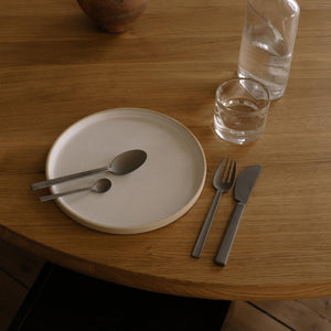 FRAMA X OLE PALSBY CUTLERY on wooden table  with plates and glasses