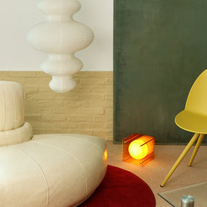 lop small square table lamp in orange in living room with furnitures