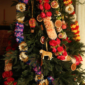 tinsel tiger ornament for xmas by doing goods on colourful decorated xmas tree