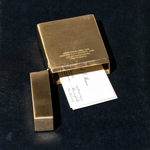 puebco brass case holding business card