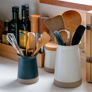 ceramic cutlery holders on kitchen table