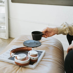 oct coffee cup in black by kinto being used