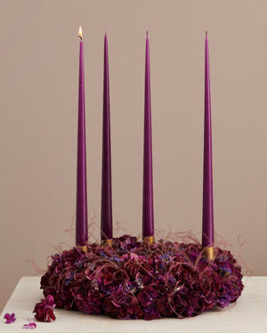 dark plum tapered candles on xmas wreath styling