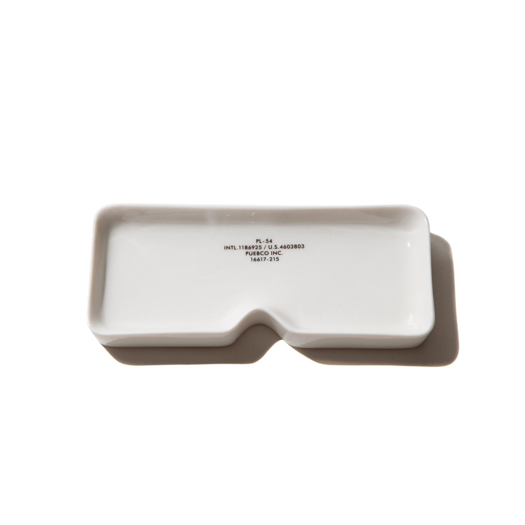 white ceramic eyeware plate by puebco