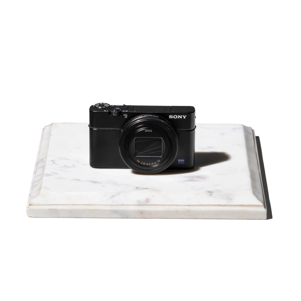 square white marble display with camera on top