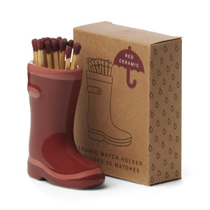 red ceramic wellington boots holding matches