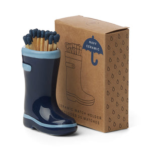 navy blue ceramic wellington boots holding matches